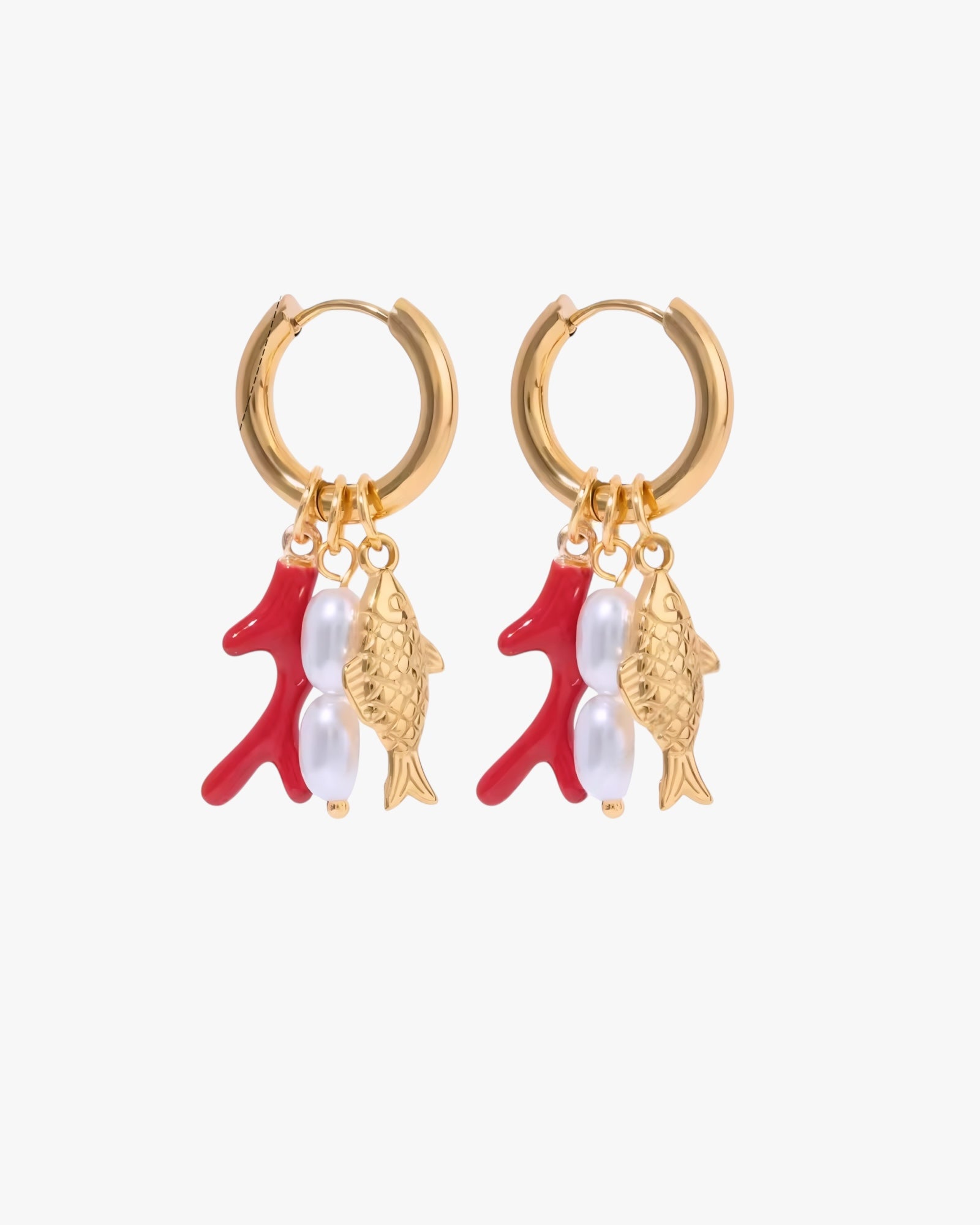 Gold hoop earrings with red fish and white pearls on a white background
