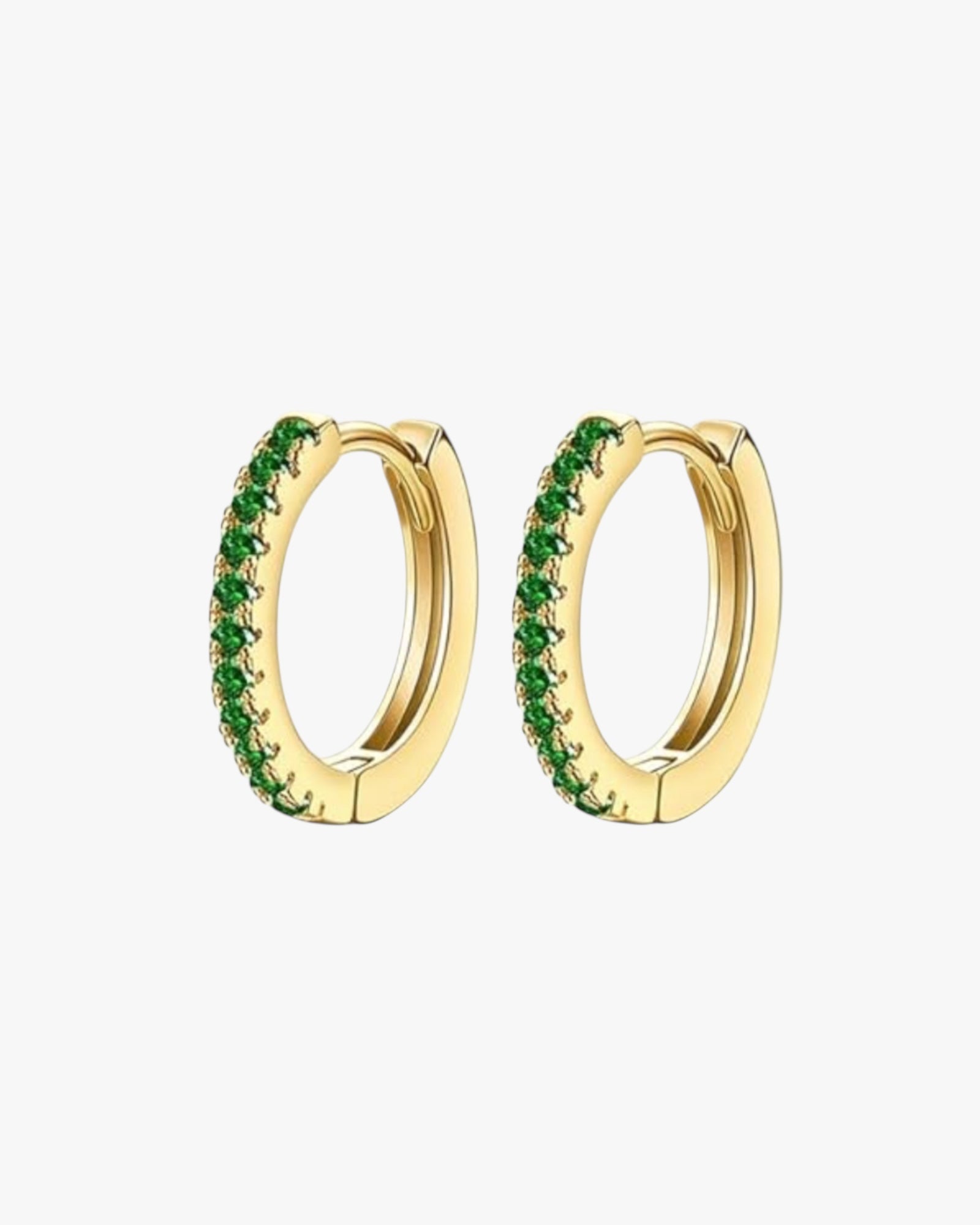 A pair of gold-colored stainless steel hoop earrings with green accents, designed for piercings.