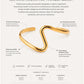 Gold bracelet with product details on a white background