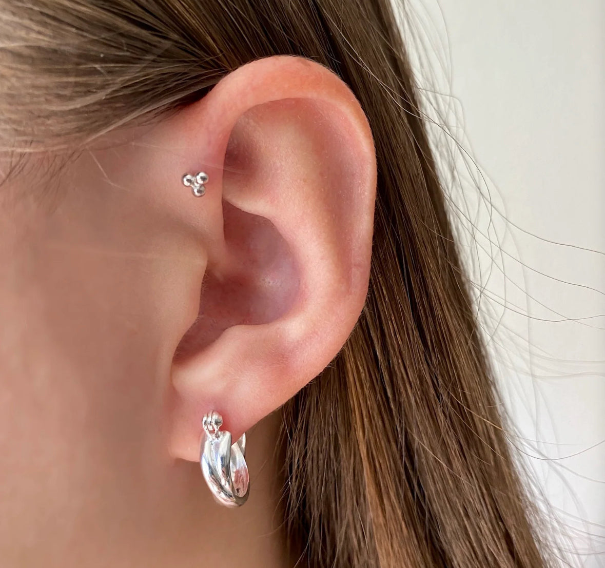 Hypoallergenic stainless steel studs for lobe and cartilage piercings. Durable, tarnish-resistant, and ideal for everyday wear.