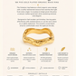 Gold-plated ring with product details on a beige background