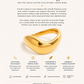 Gold ring with text describing its features on a white background