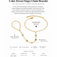 Gold finger chain bracelet with color zircon stones on a white background