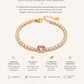 Gold-plated stainless steel bracelet with pink center stone on a white background