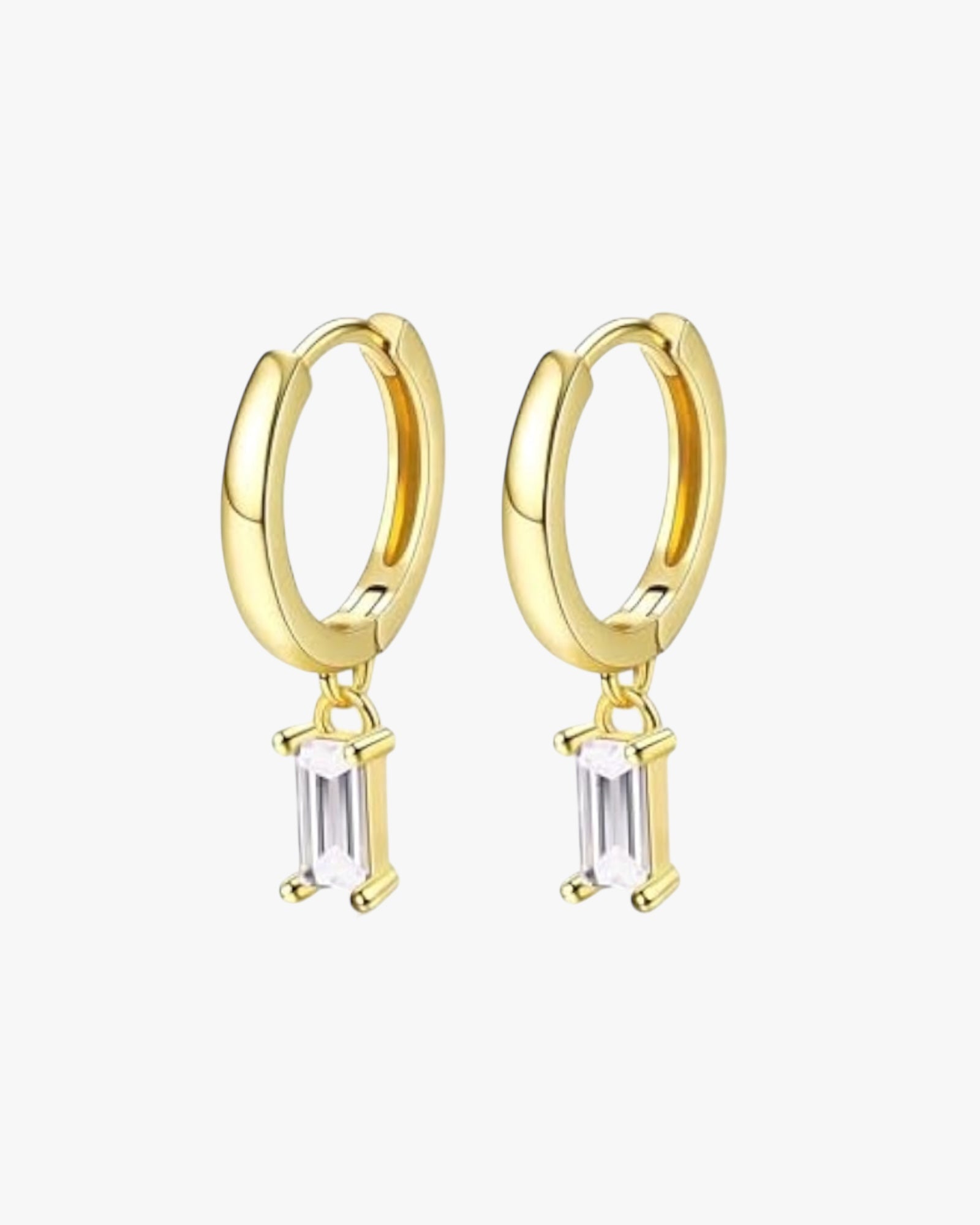 A pair of gold hoop earrings with small clear crystal pendants.