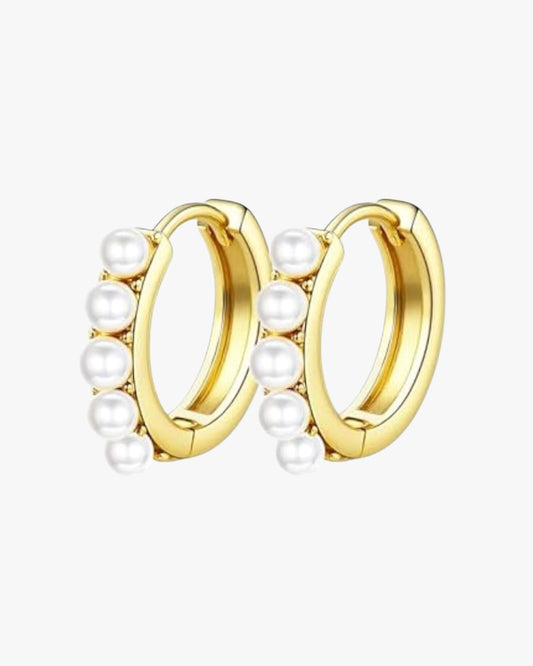 A pair of gold-colored hoop earrings with pearl accents