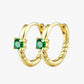A pair of gold-colored hoop earrings with green gemstones, crafted from 14K gold plated stainless steel.
