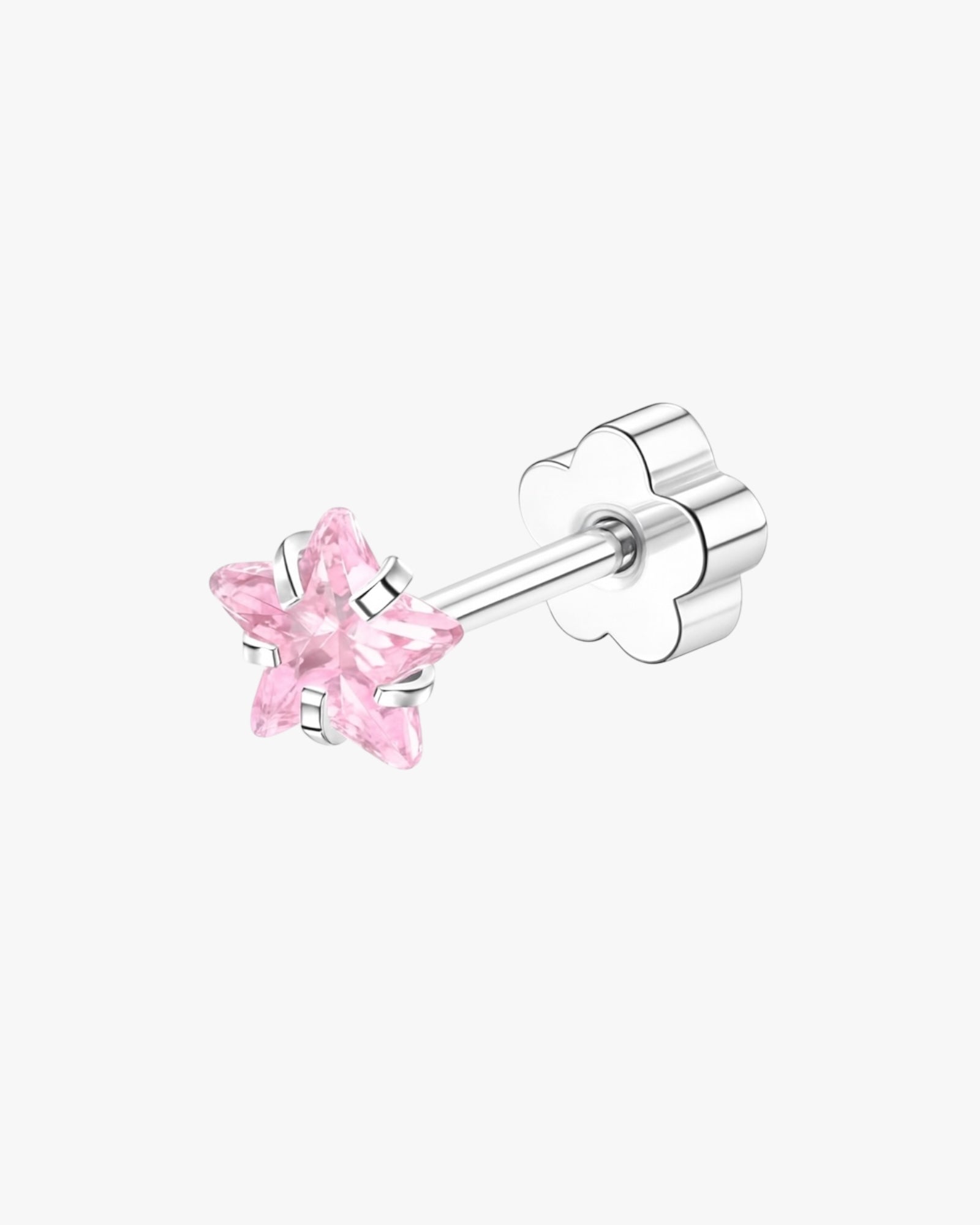 Pink star-shaped earring on a white background