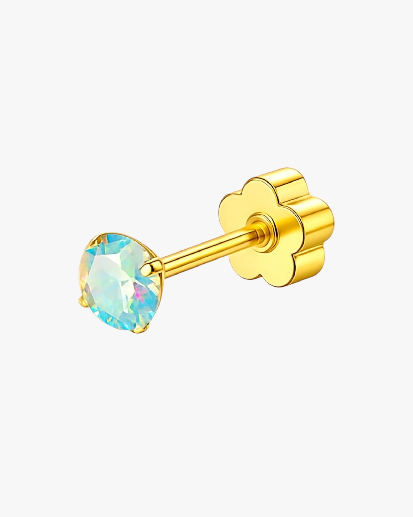 Gold earring with a colorful gemstone on a white background