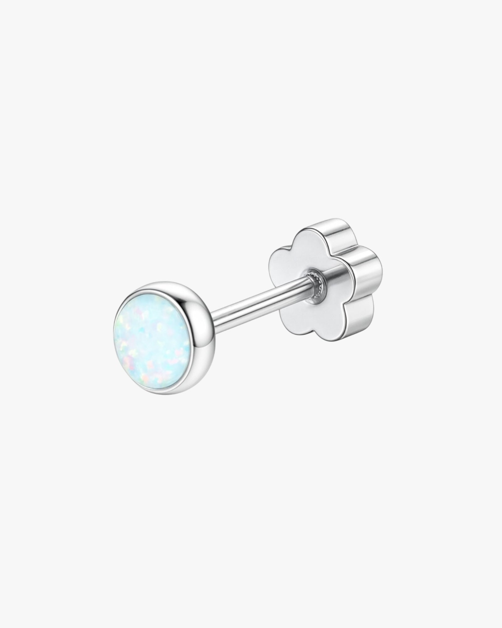 Silver stud earring with a light blue gemstone on a white background