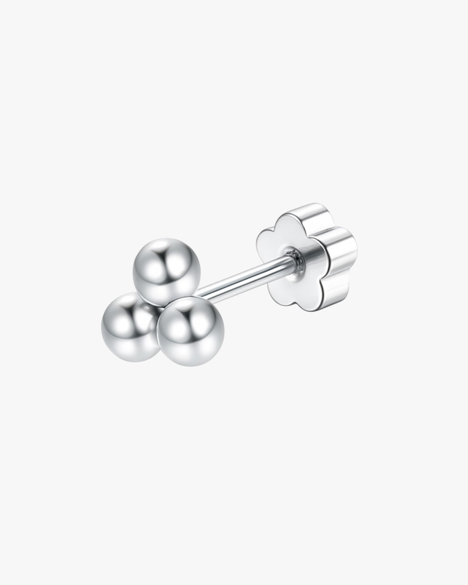 Silver stud earrings with three round balls on a white background