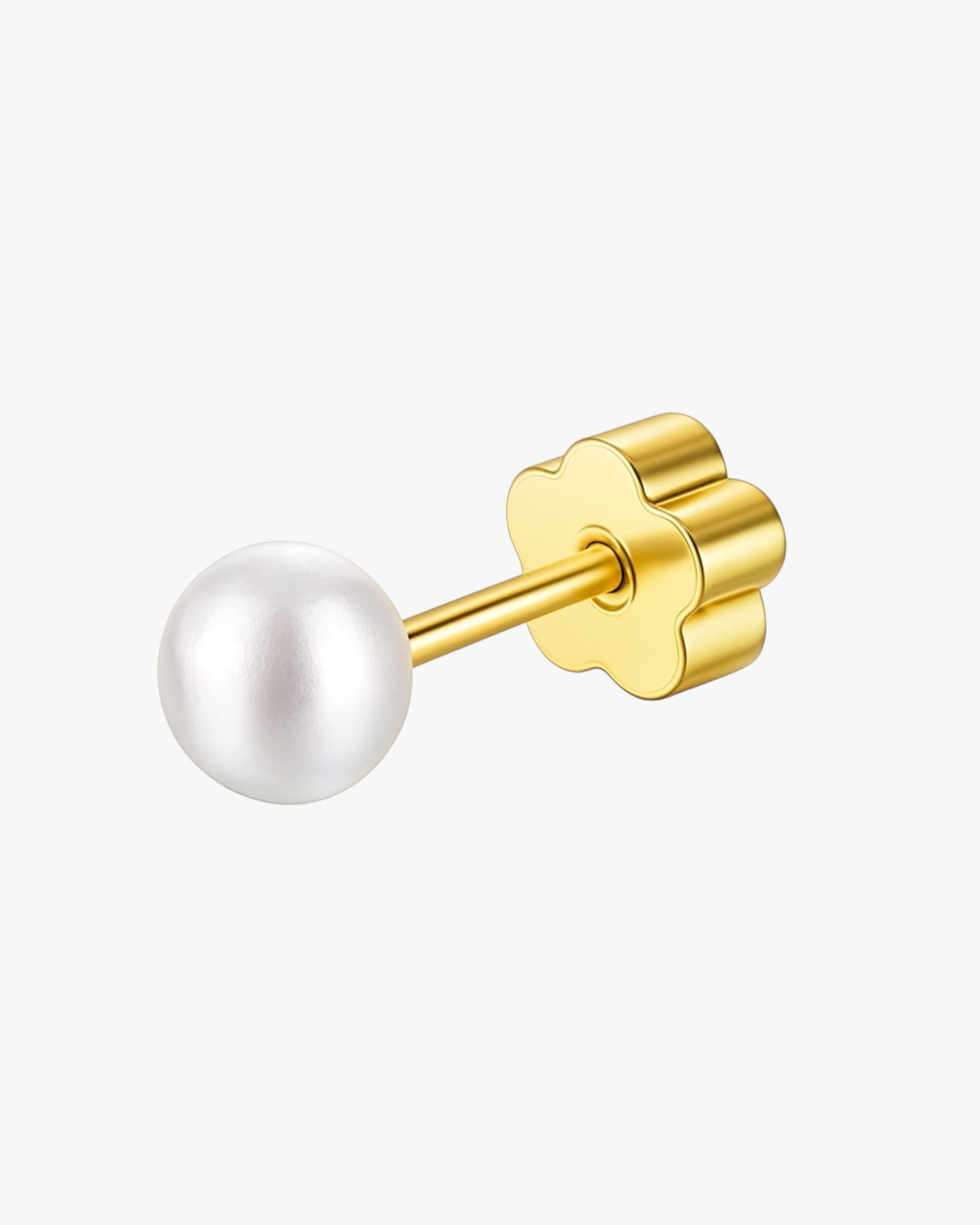 Gold earring with a white pearl on a white background
