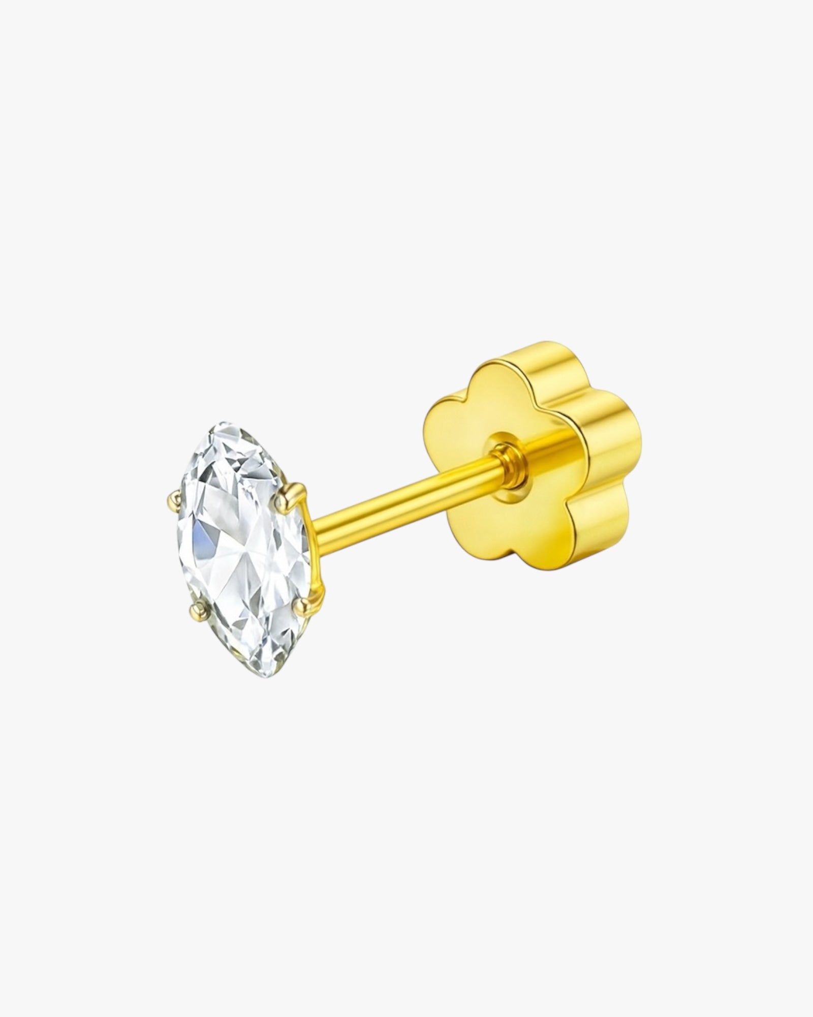 Gold earring with a clear gemstone on a white background