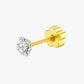 Gold earring with a clear gemstone on a white background
