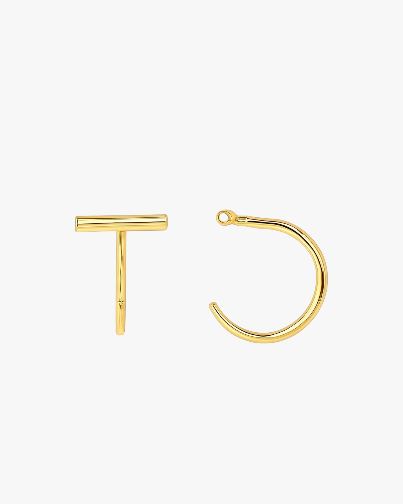 Gold hoop earring and bar on a white background