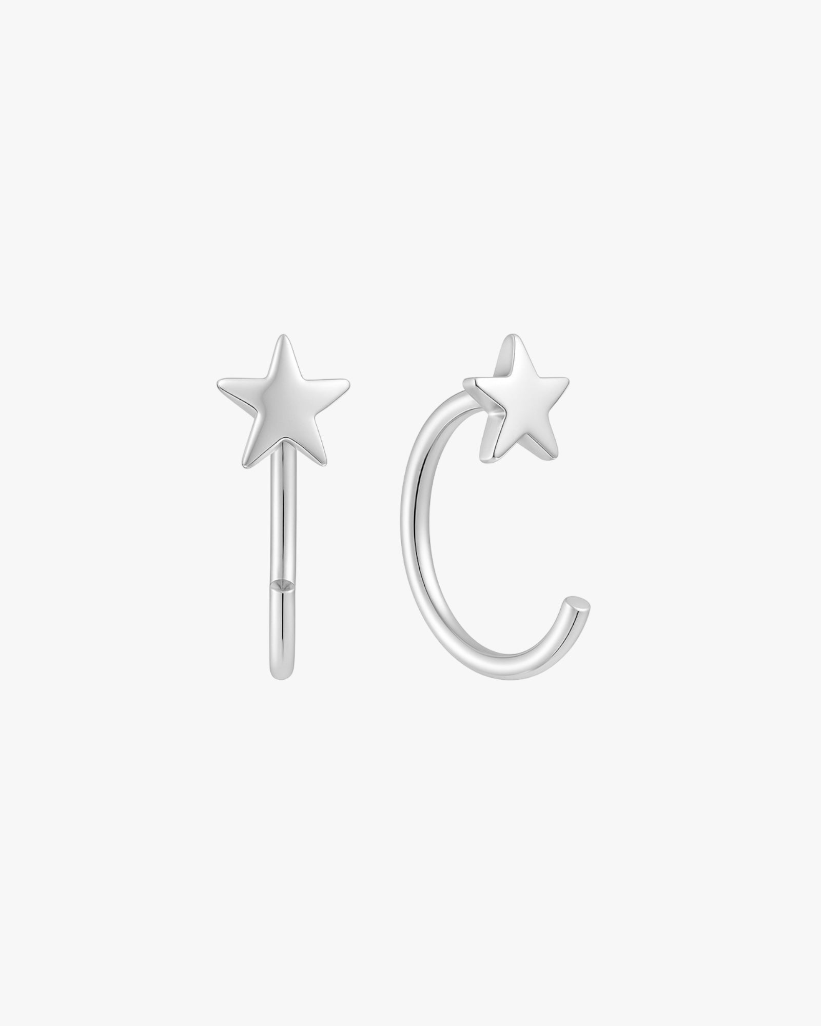 Silver star-shaped earrings on a white background