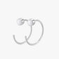 Silver hoop earring on a light gray background