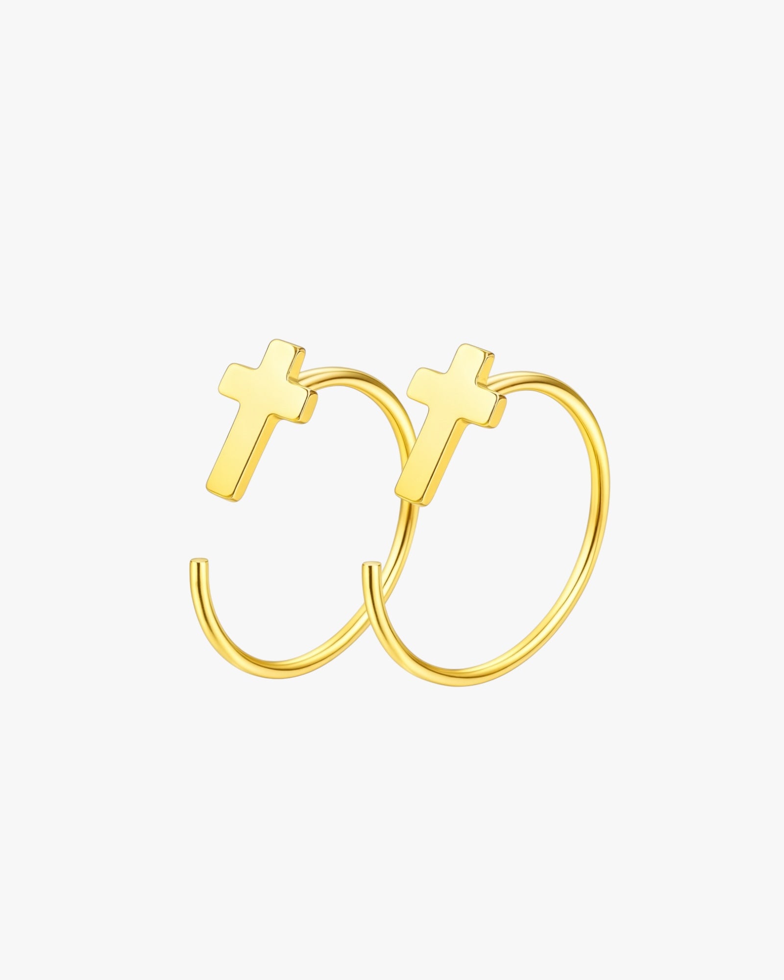 Gold hoop earrings with cross designs on a white background