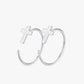Silver hoop earrings with cross designs on a white background