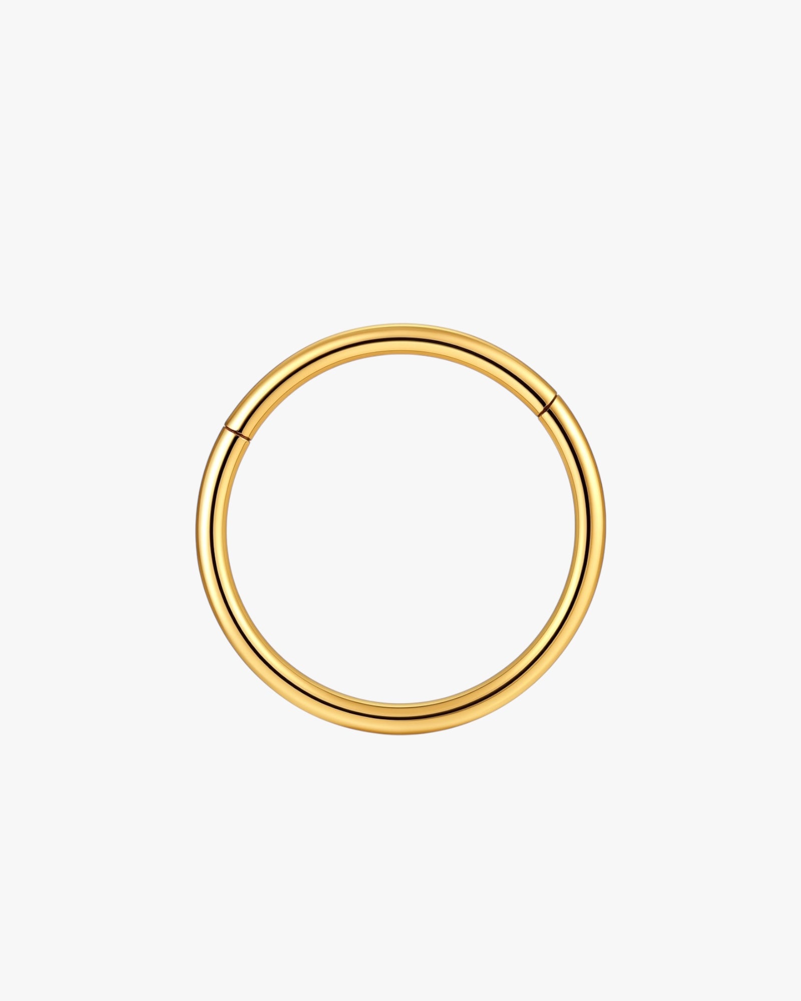 Gold hoop earring on a white background