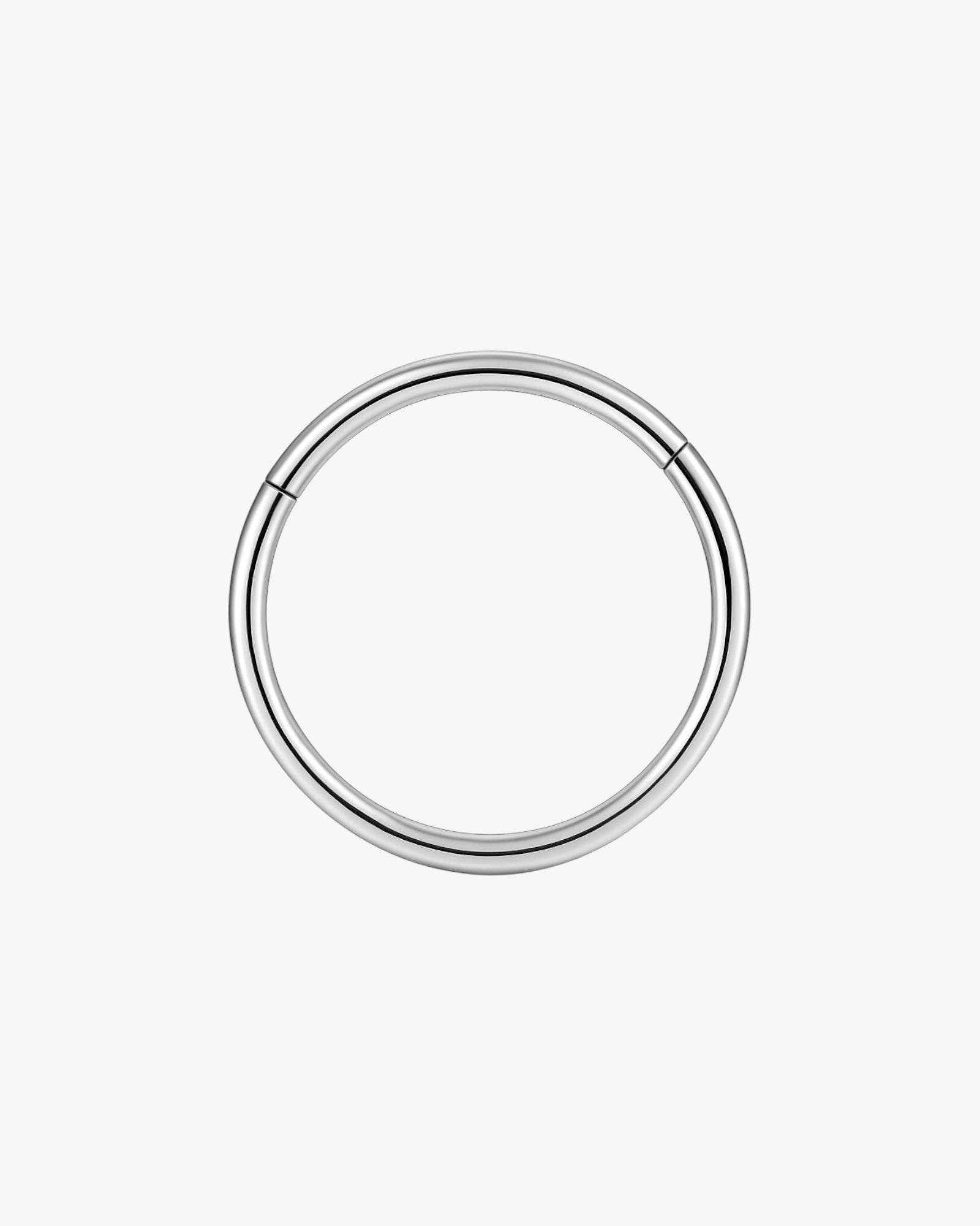Silver hoop earring on a white background