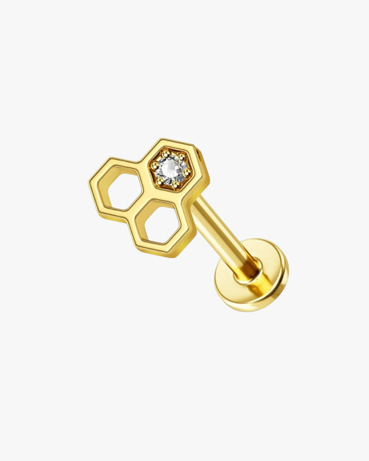 A gold-colored stainless steel stud earring with a bee hive design, featuring a small clear crystal in the center.