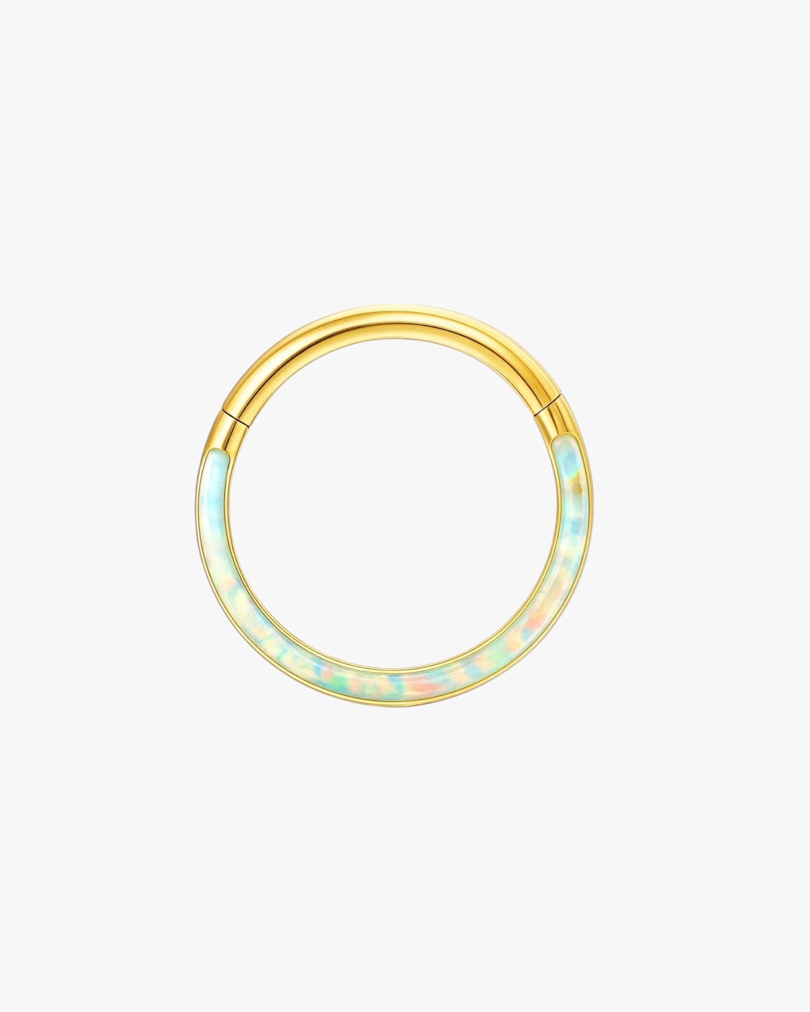 Gold hoop earring with opal-like stones on a light beige background