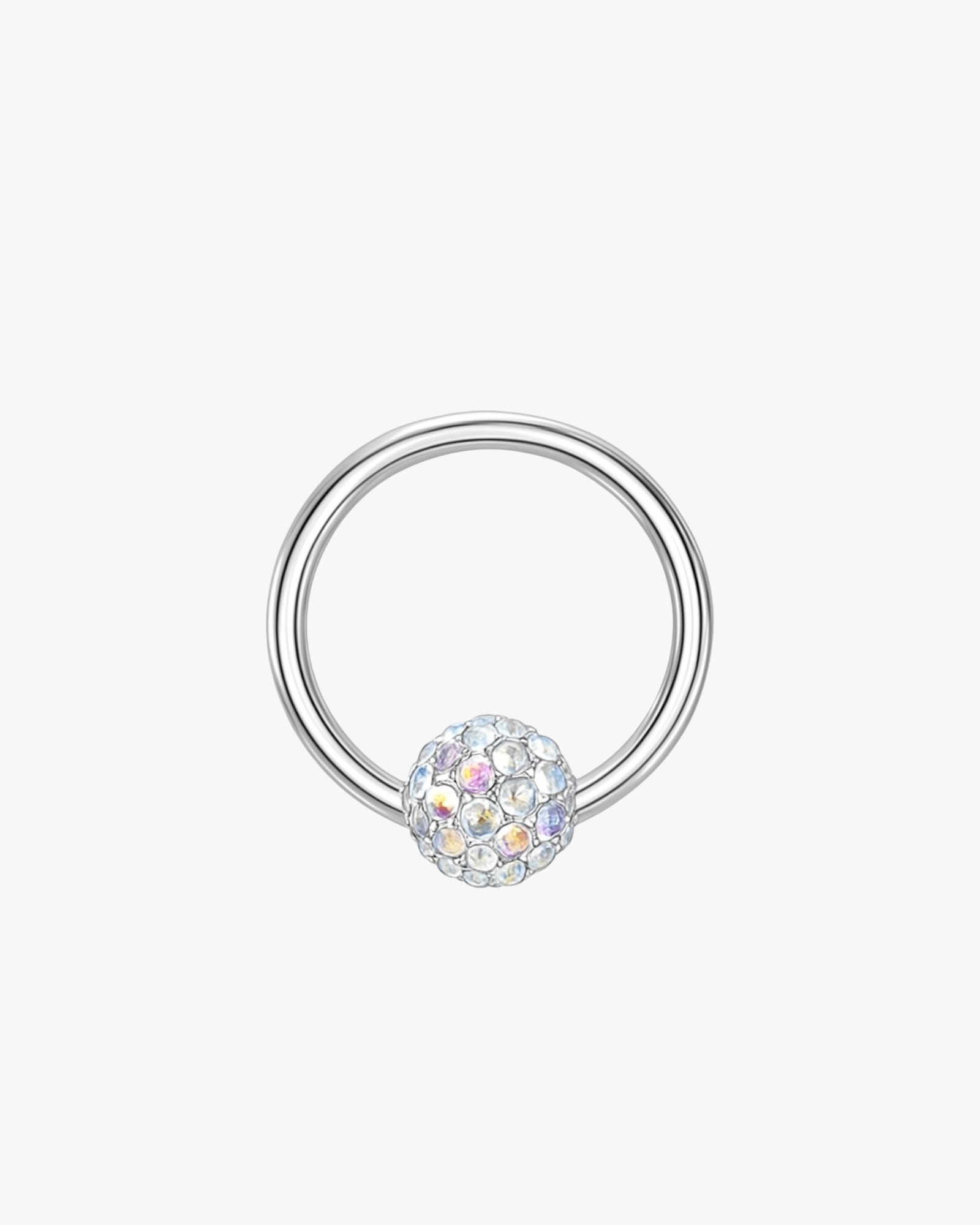 Silver hoop with a crystal ball on a light gray background