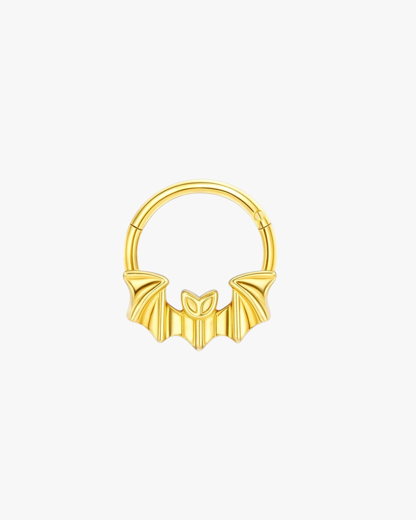 Gold bat-shaped earring on a light gray background