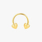 Gold hoop earring with heart-shaped ends on a white background