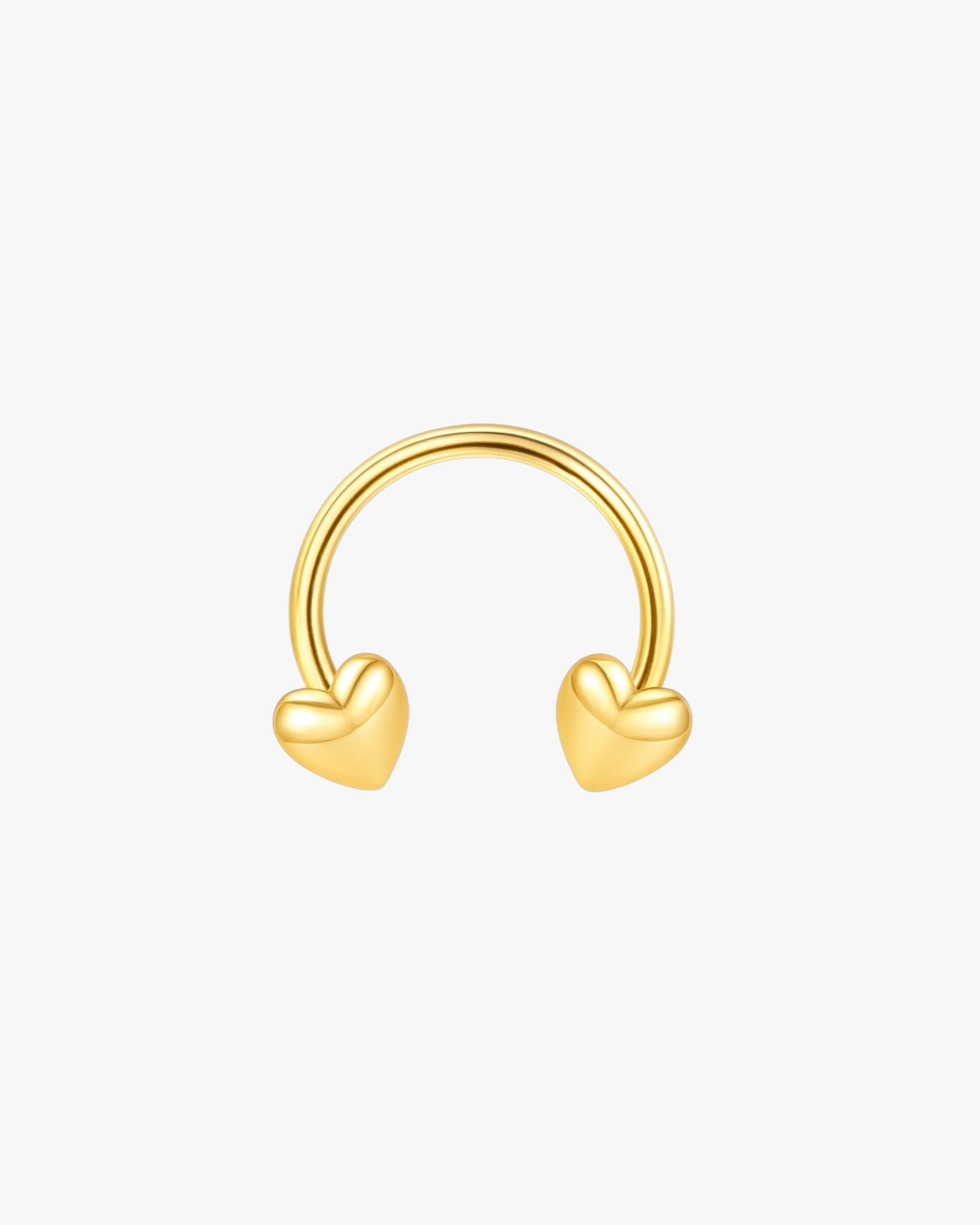 Gold hoop earring with heart-shaped ends on a white background