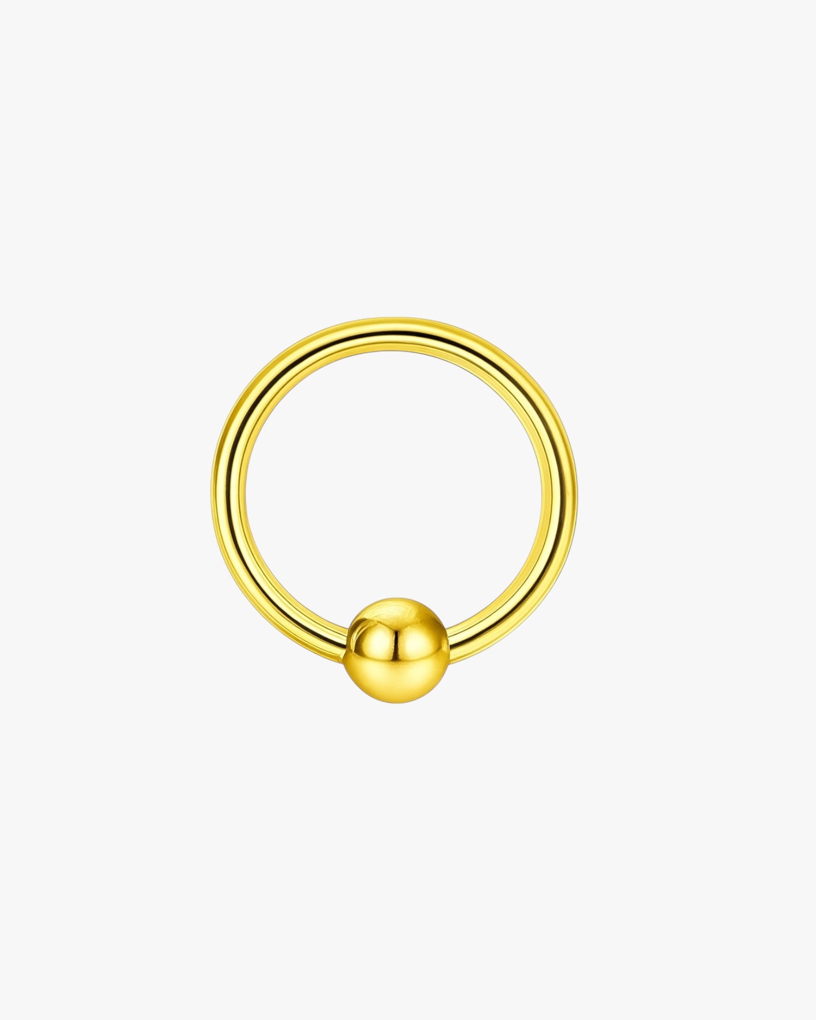 Gold hoop earring with a spherical end on a white background