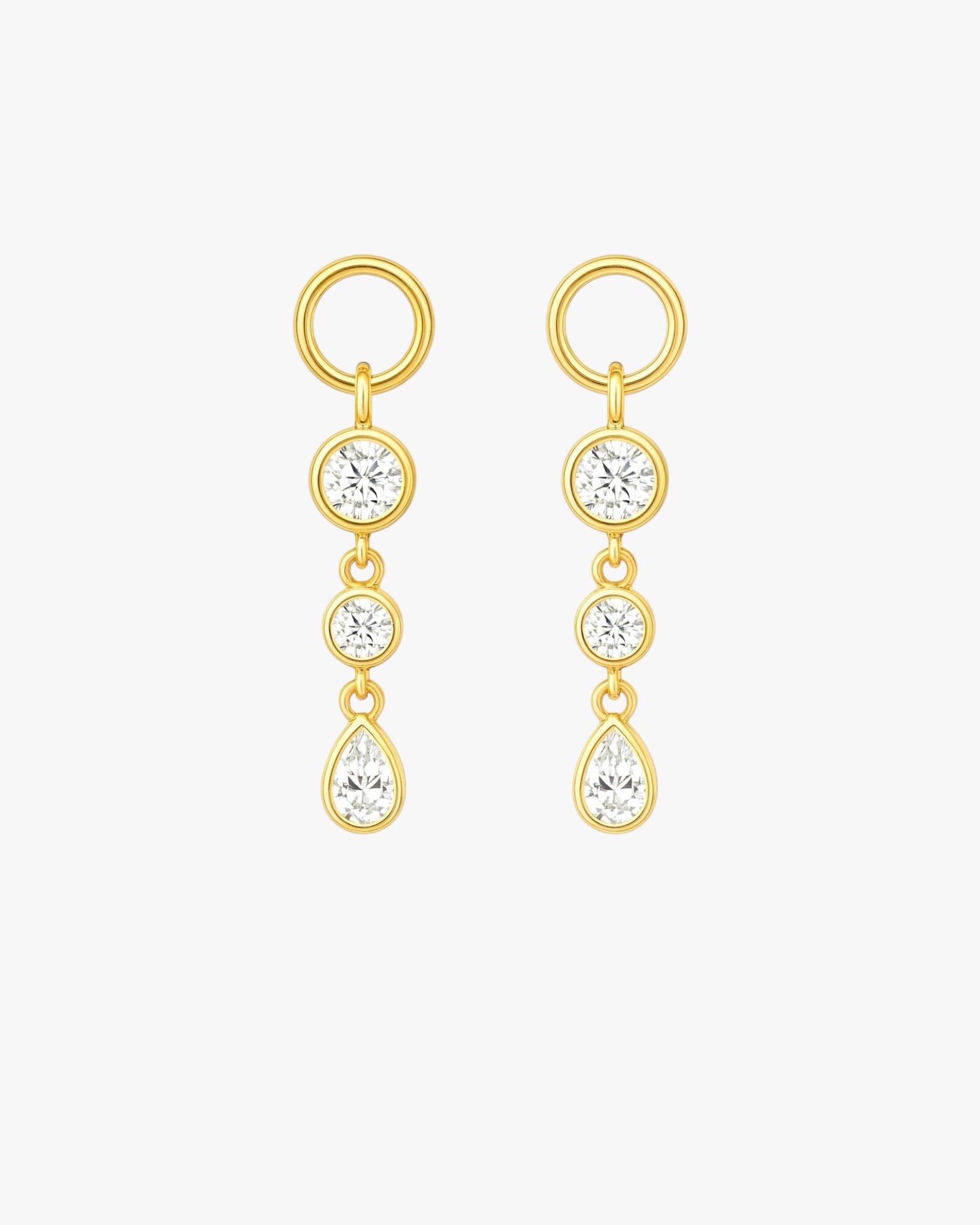 Gold earrings with multiple gemstones on a white background