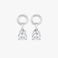 Pair of silver earrings with teardrop-shaped clear gemstones on a white background