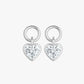 Pair of silver heart-shaped earrings with clear gemstones on a white background