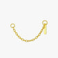 Gold chain with a small tag on a white background