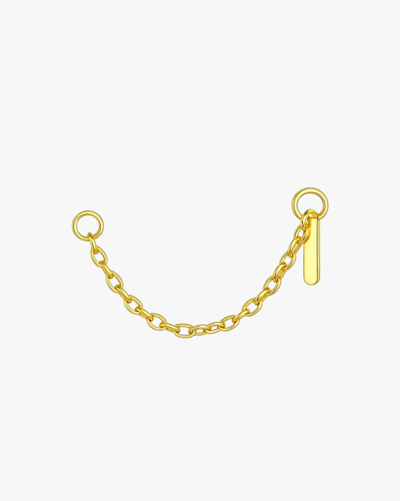 Gold chain with a small tag on a white background