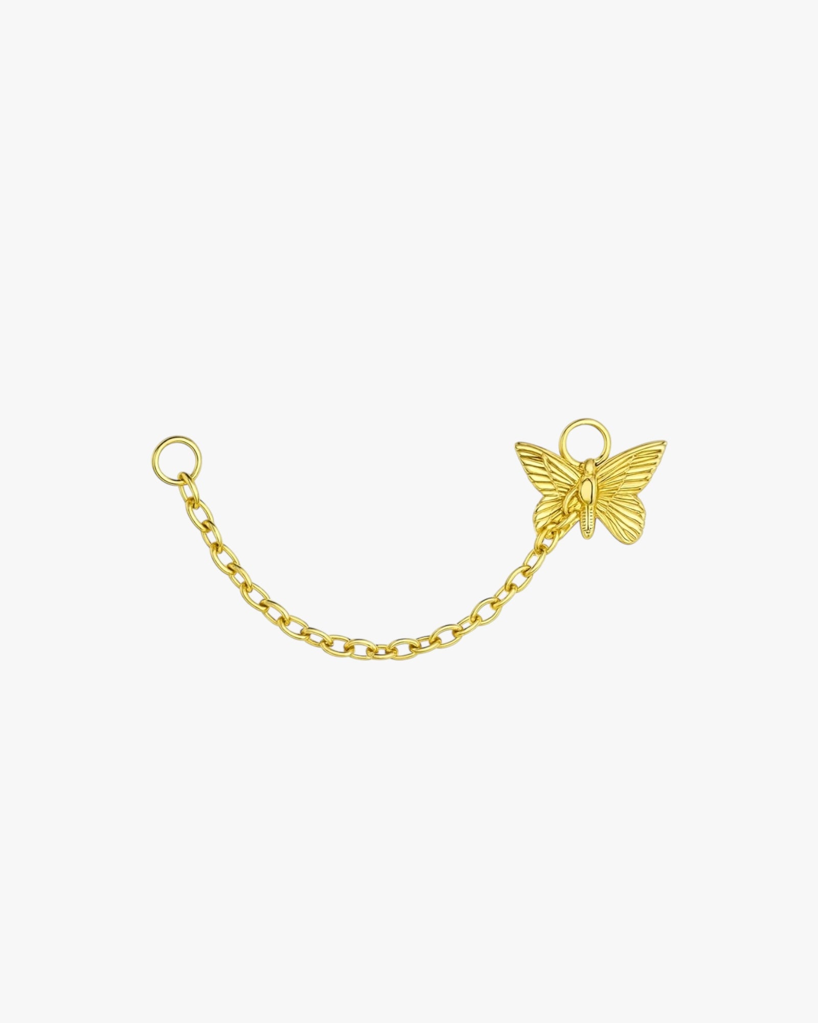Gold butterfly charm on a chain against a white background