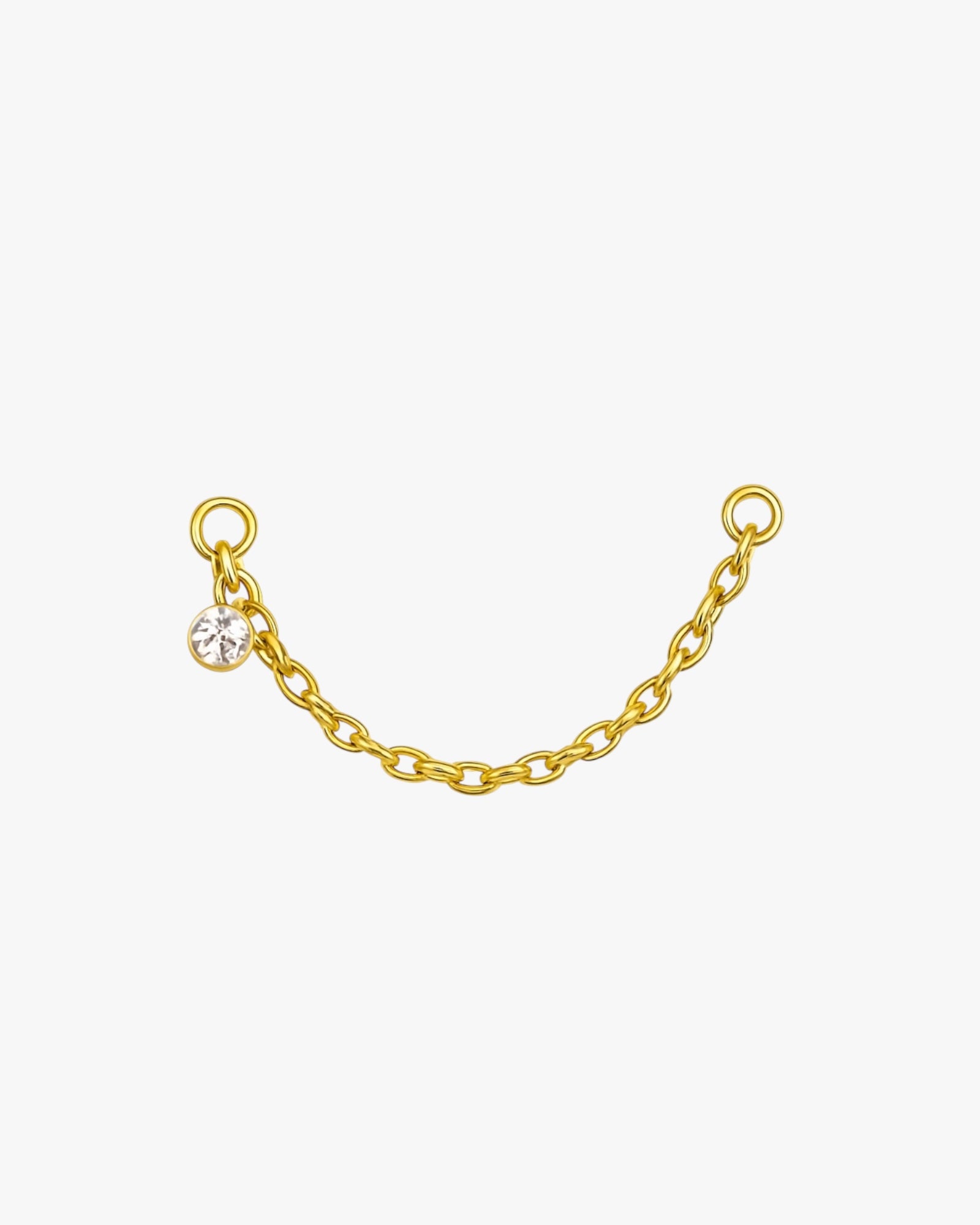 Gold chain with a small round pendant on a white background