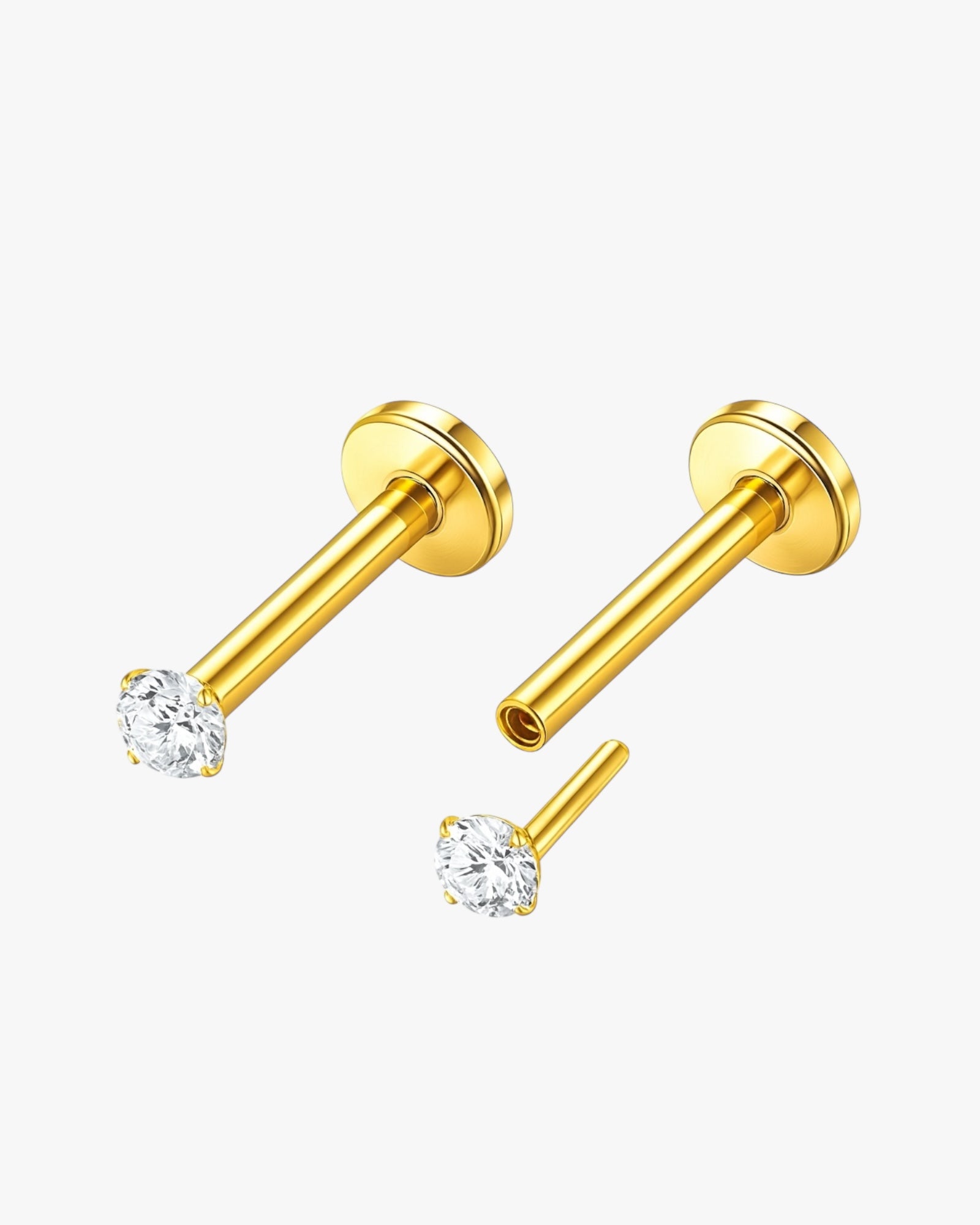 Gold nose ring with clear gemstones on a white background