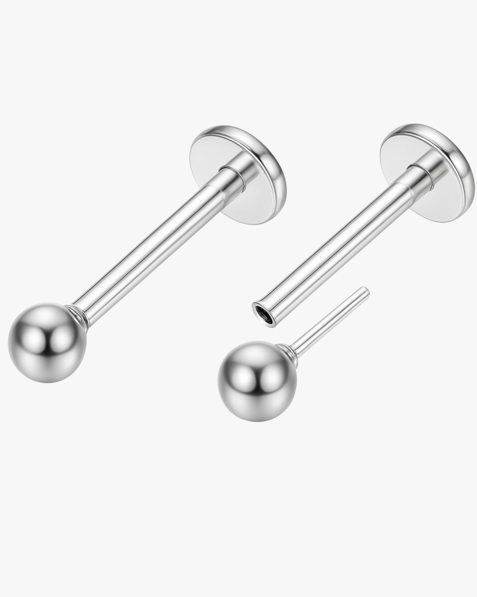 Pair of silver ball earrings on a white background