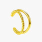 Gold hoop earring on a white background