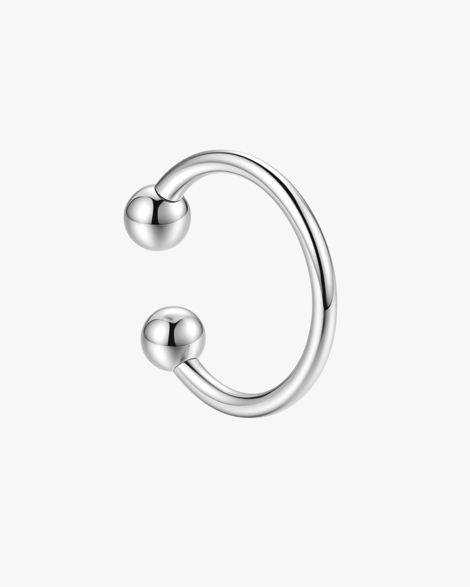 Silver ear cuff on a white background