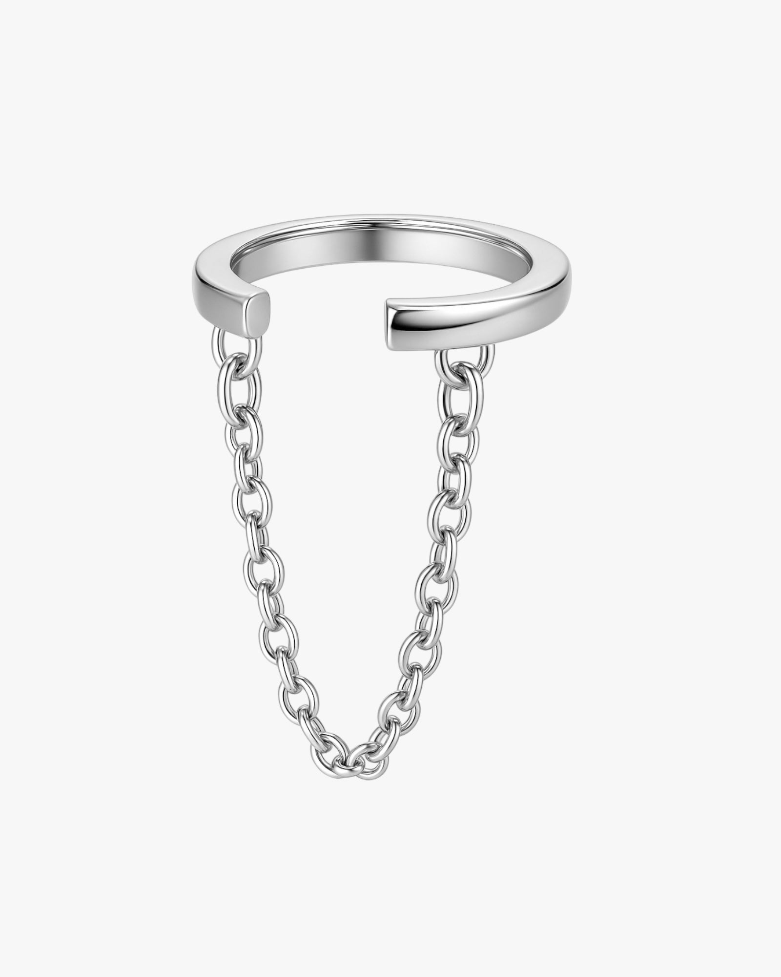 Silver ear cuff a chain attachment on a white background