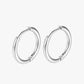 Pair of silver hoop earrings on a white background