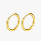 Gold hoop earrings on a white background