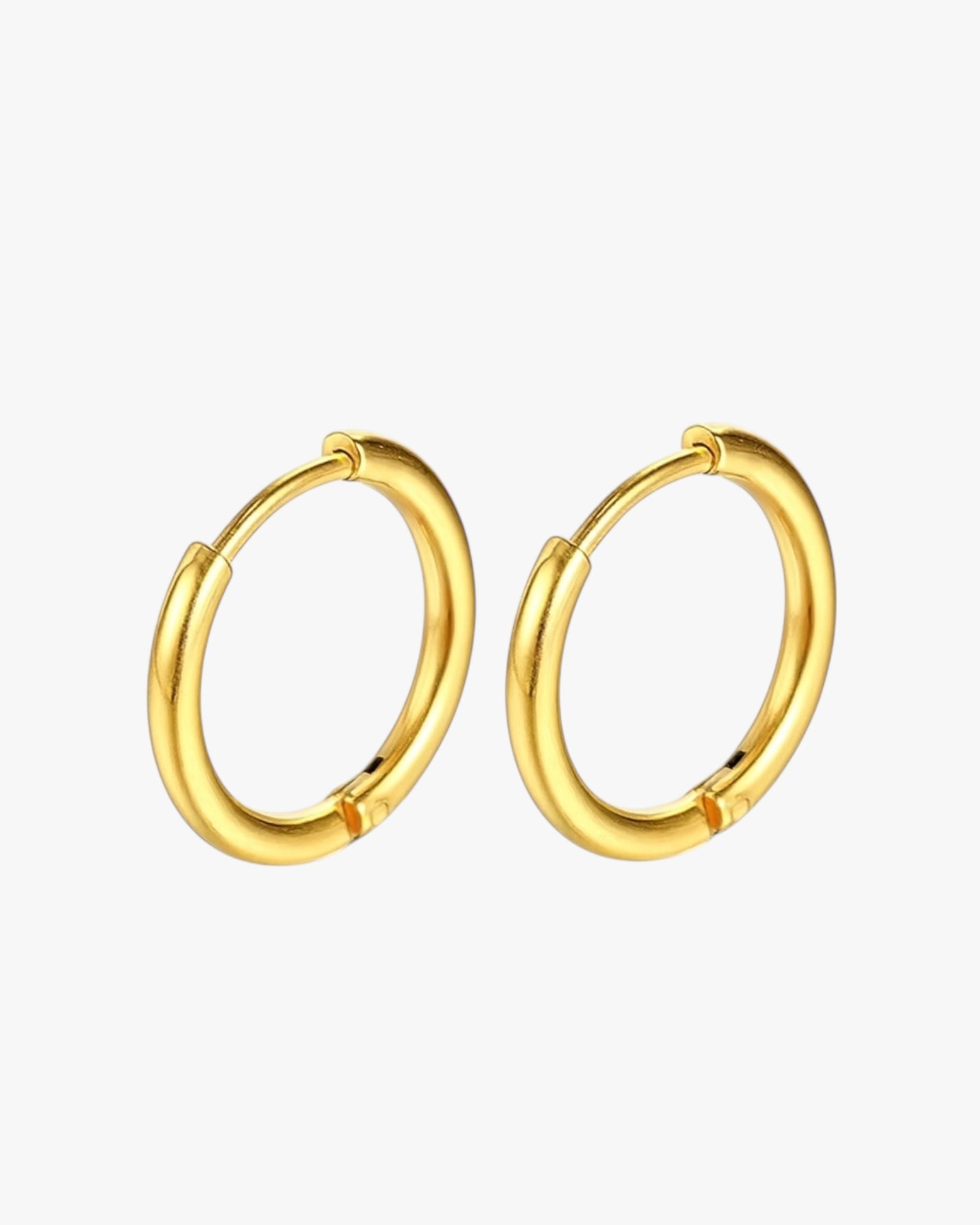 Gold hoop earrings on a white background