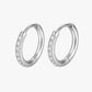 Pair of silver hoop earrings with embedded stones on a white background