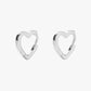 Heart-shaped silver hoop earrings on a white background