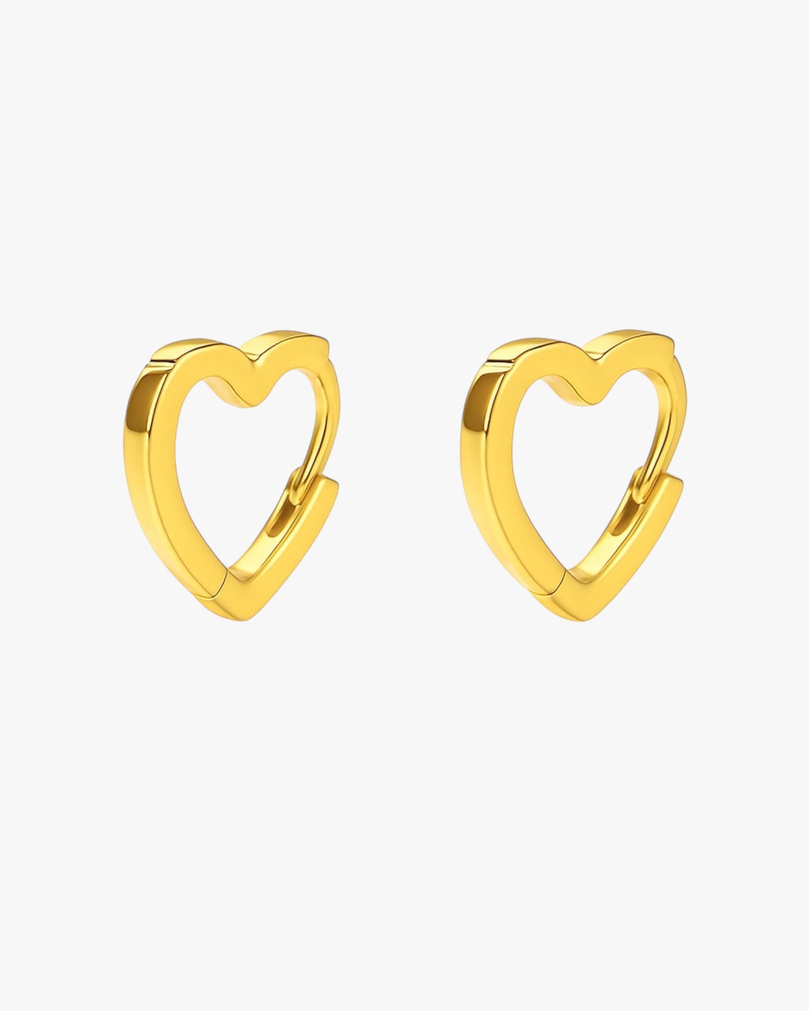 Gold heart-shaped hoop earrings on a white background